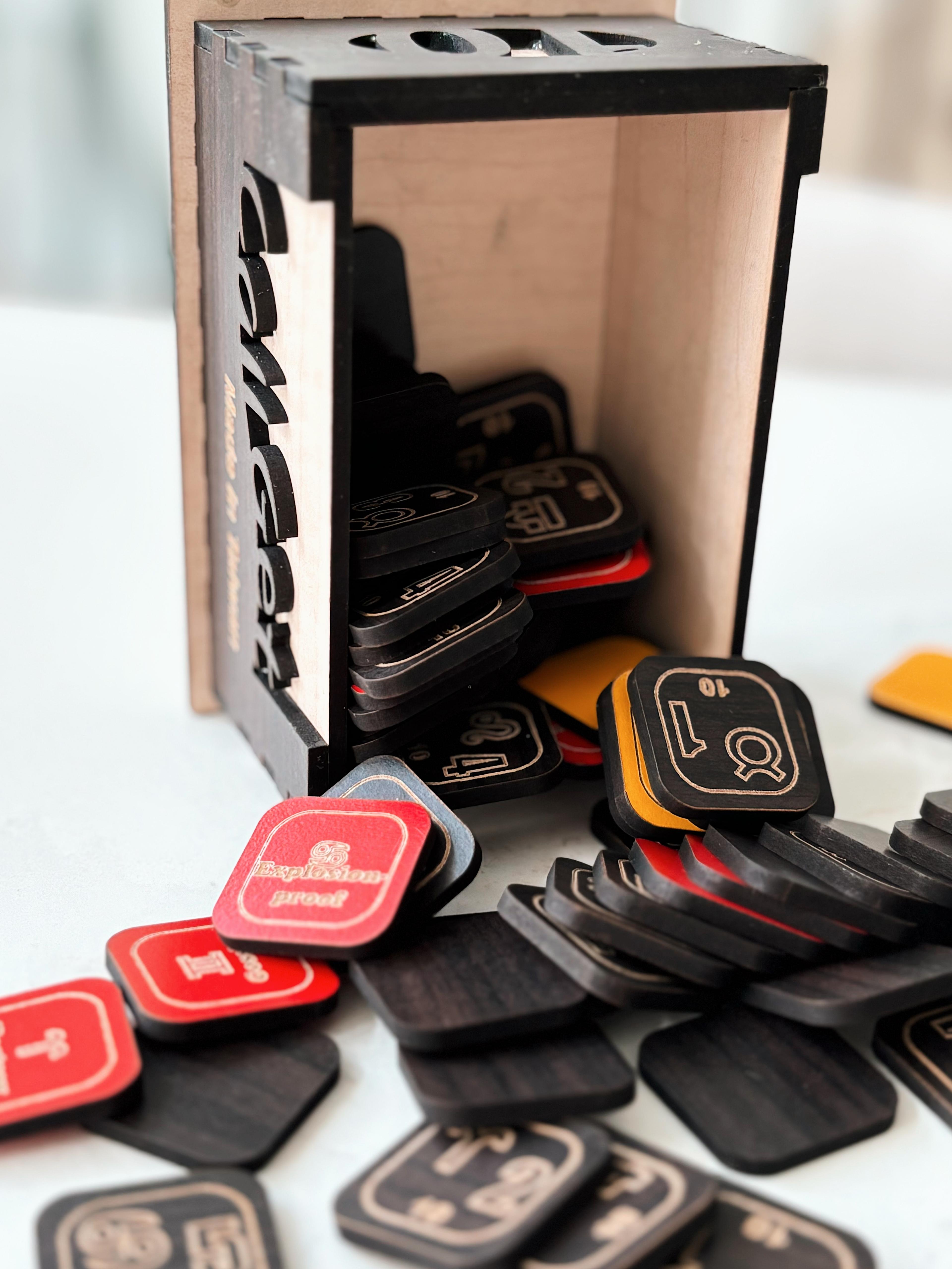 Game tiles spilling from a handcrafted wooden box