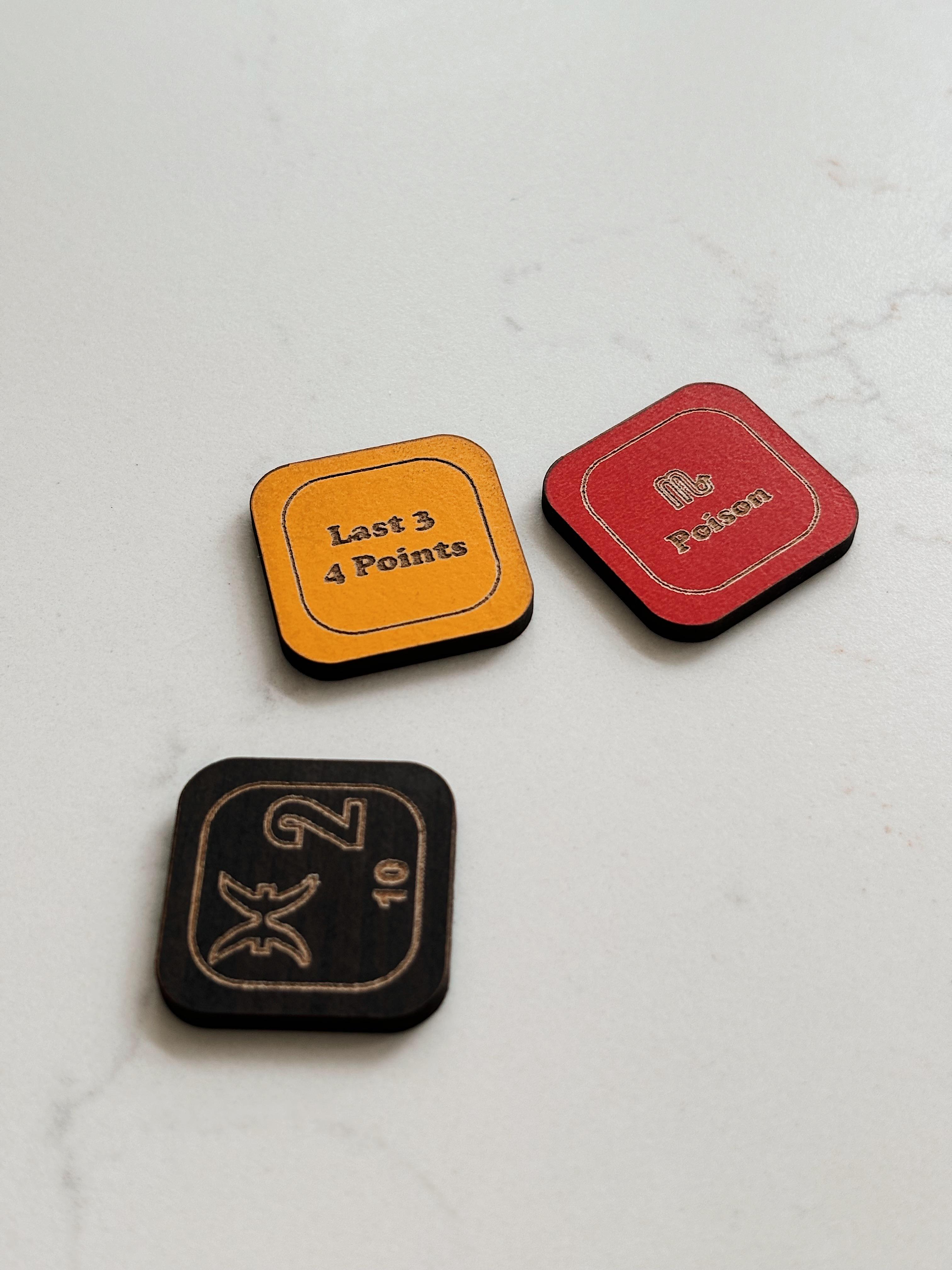 Close-up of engraved astrology game tiles