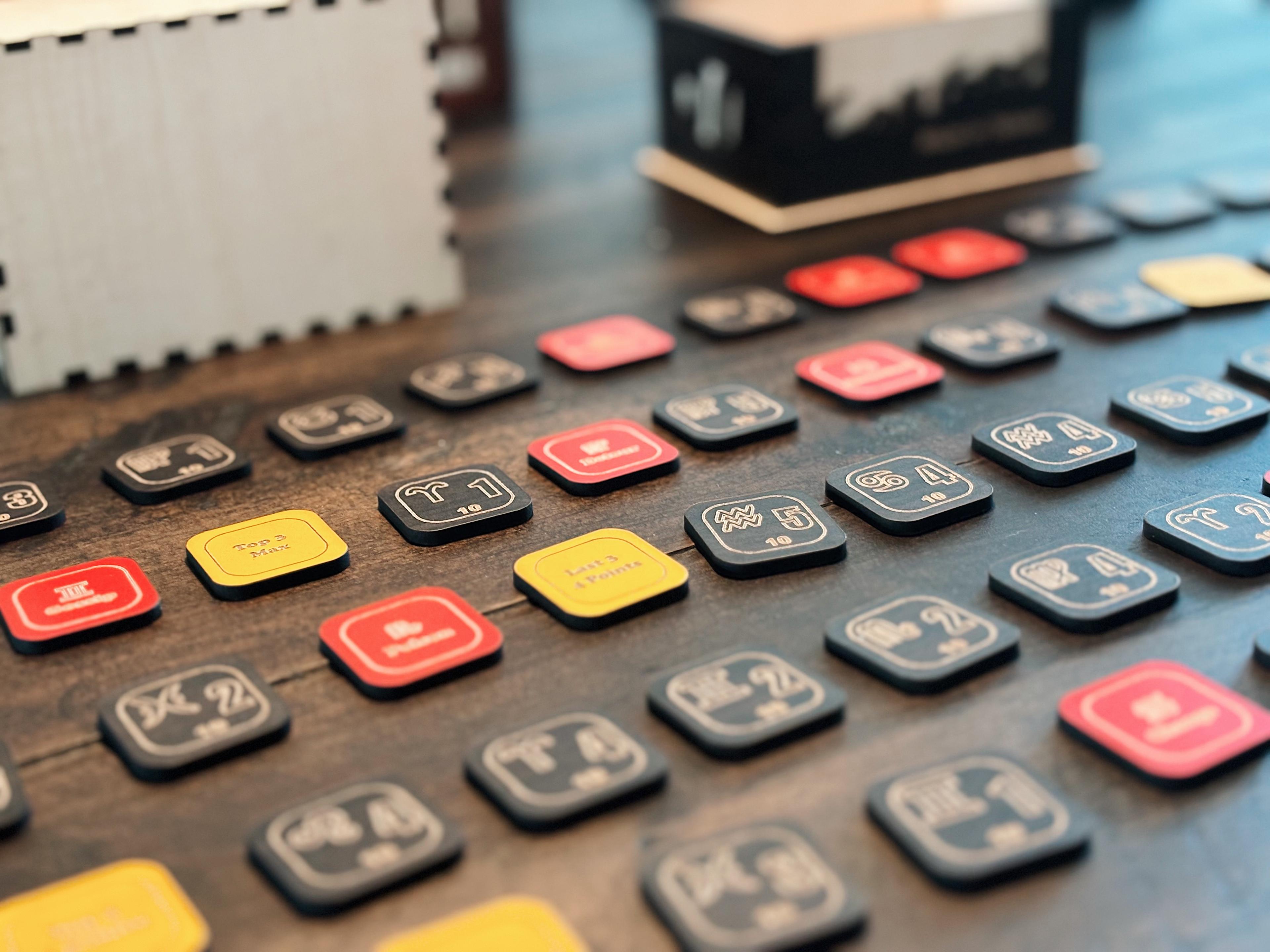 Oracle game tiles spread across a wooden table